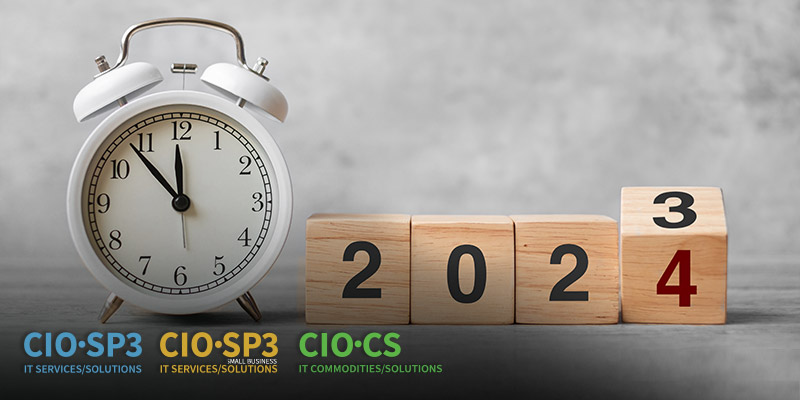 an image of a clock next to four wooden blocks spelling out the year 2024